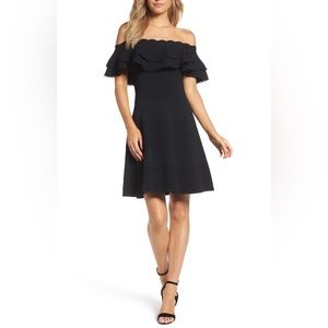 Off the shoulder, black fit & flare dress. Super flattering and well made. 🖤👗